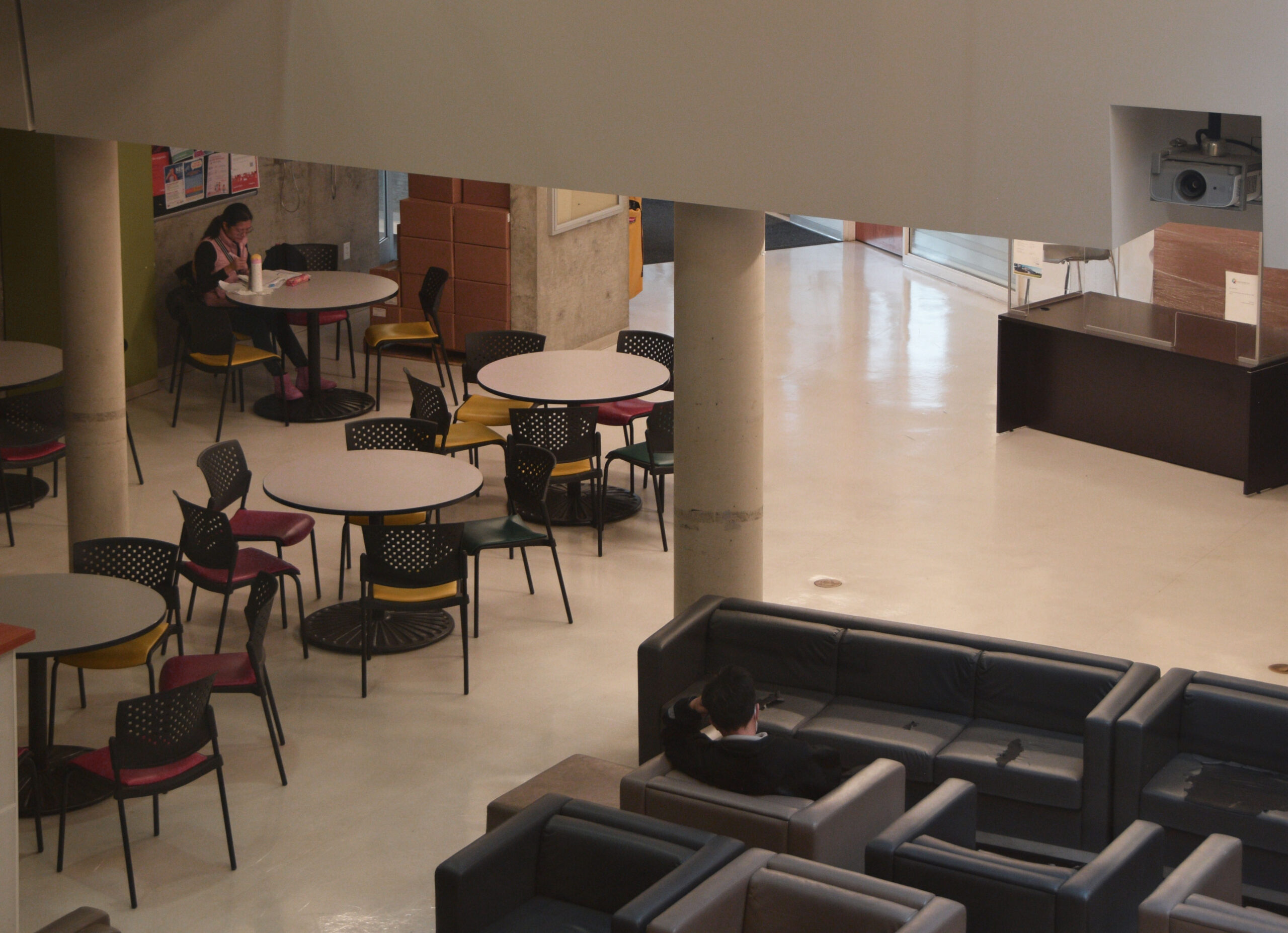 Seating and tables in the LSU building seen from above.
