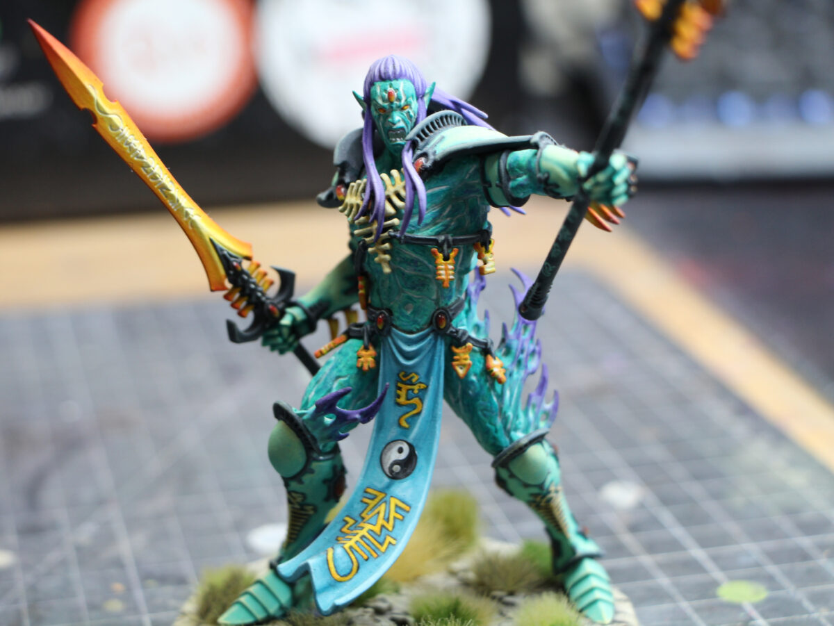 A teal-coloured Avatar of Khaine from Warhammer 40k
